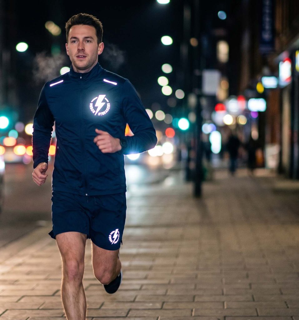 Reflective heat transfer logo on running jacket